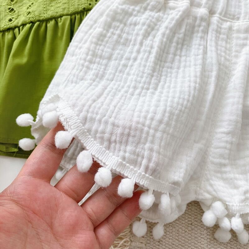 Eyelet top and Pom Pom shorts